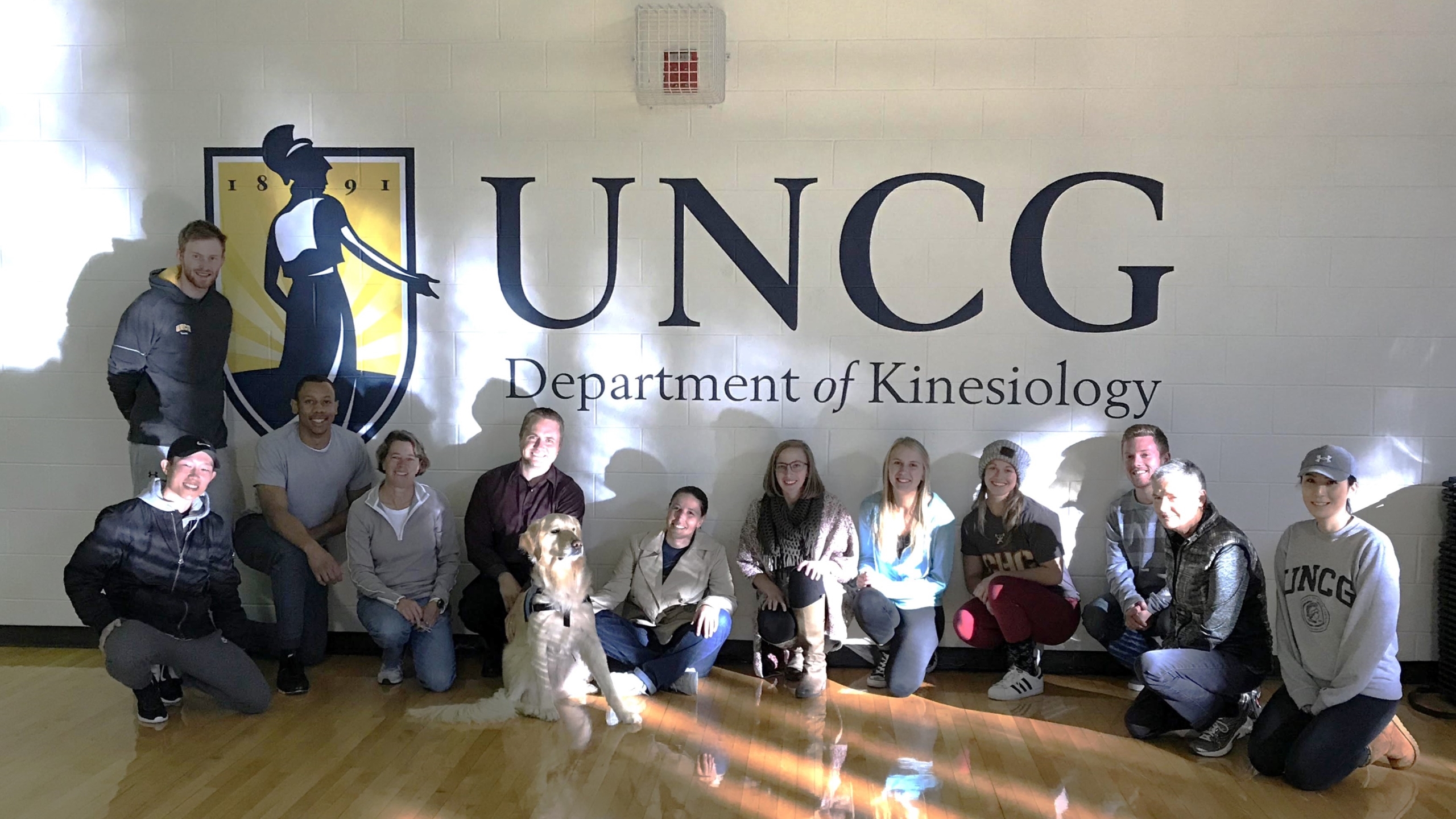 Master Students in Sport and Exercise Psychology with Remington the Medical Alert Assistance Dog