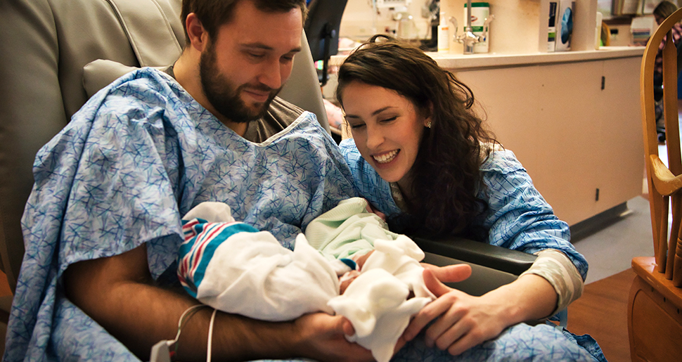 Amanda Durall, her husband, and her newborn baby