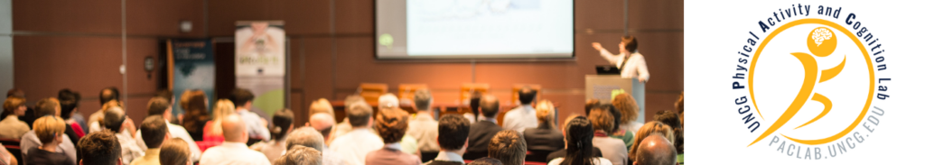 People Watching Speaker at Conference