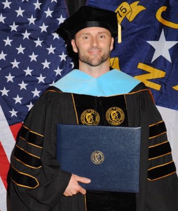 Dave Jones, EdD Graduate holding diploma
